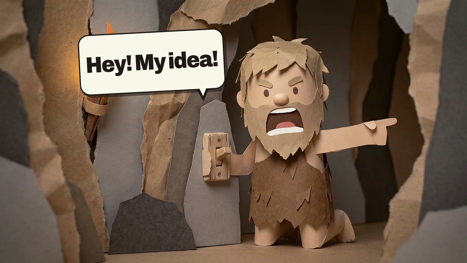 A paper caveman in a torch-lit paper cave points and shouts, Hey! My idea!